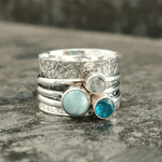 Handcrafted Floral Silver Spinner Ring with Blue Gemstones - Ring